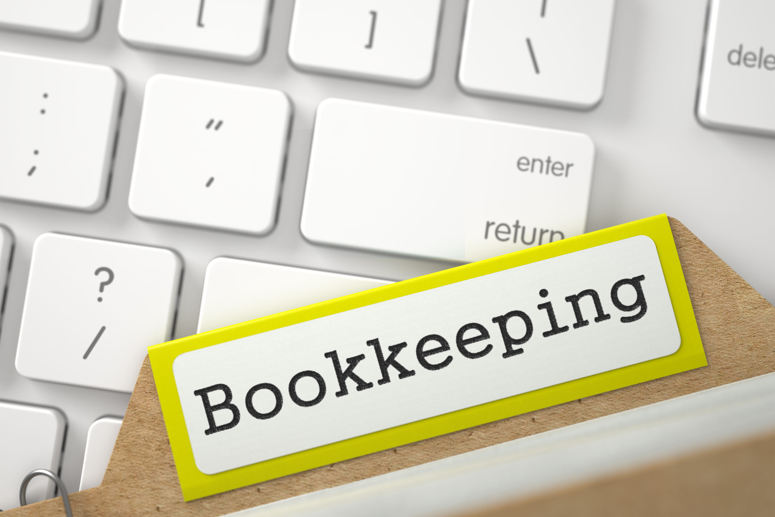 Bookkeeping. Yellow Folder Register Overlies White Modern Computer Keypad. Archive Concept. Close Up View. Selective Focus. 3D Rendering.